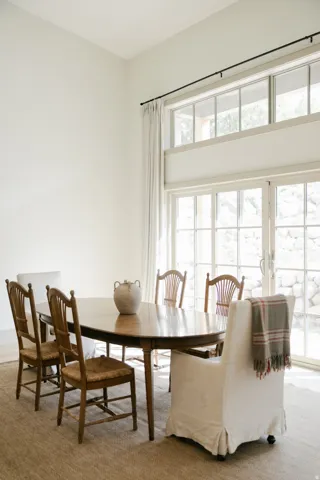 High ceilings with transom windows and large glass doors