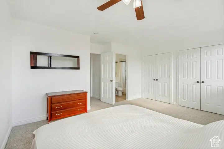 White walls and carpeting create a bright interior