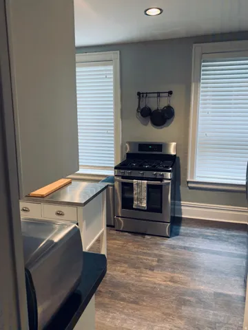 Kitchen featuring wood-finish flooring, recessed lighting, and stainless steel appliances