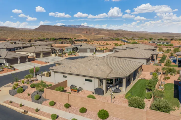 Expansive residential community featuring a variety of properties with neutral-toned stucco exteriors and multi-pitched tile roofs
