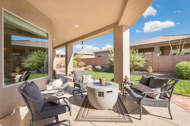 Covered patio featuring a concrete slab surface, recessed lighting, and support columns
