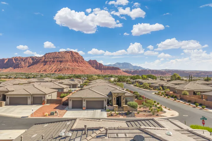 Neighborhood setting with natural rock formations in the background
