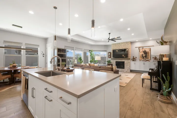 Kitchen island with a built-in sink and pendant lighting