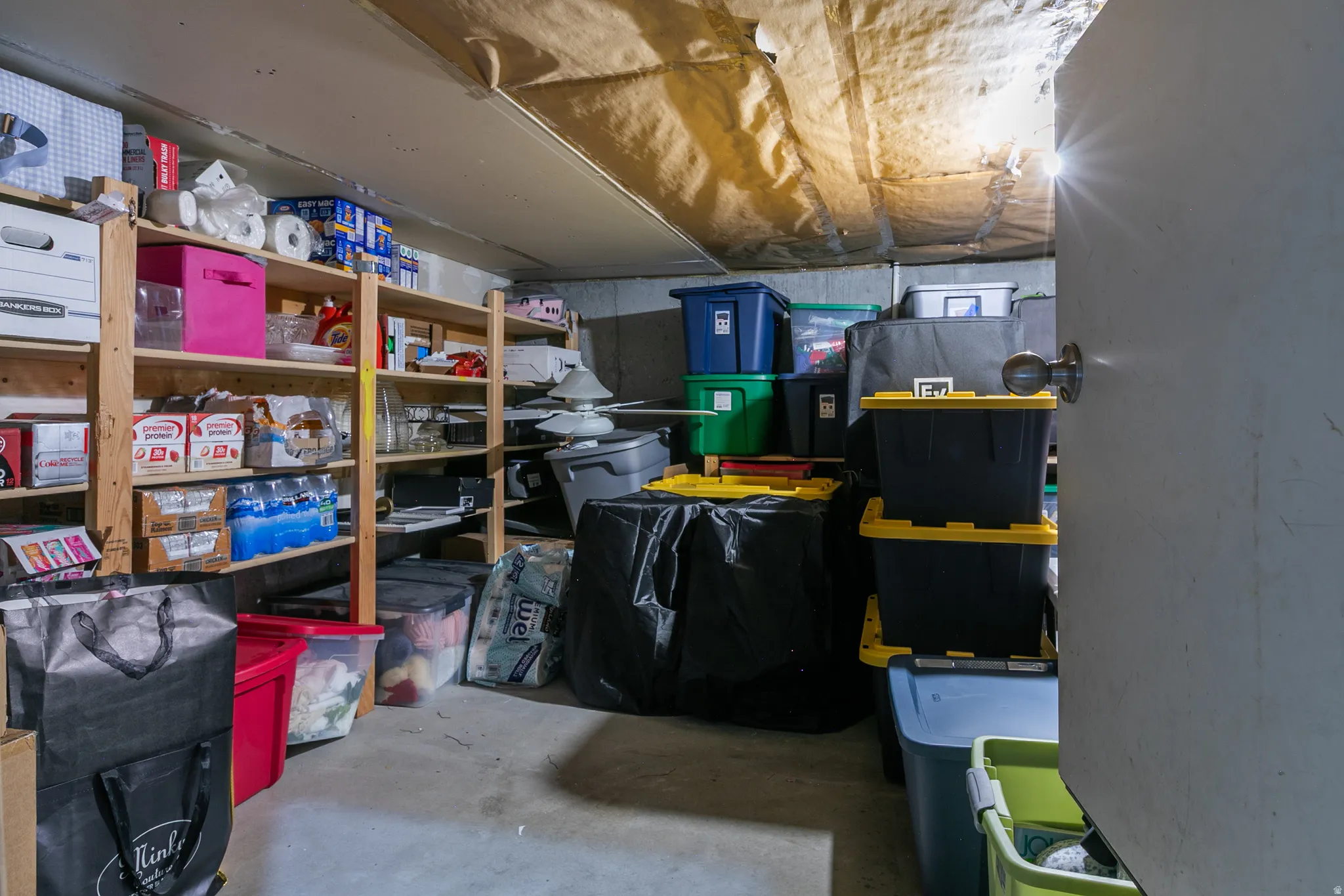 Exceptional storage under the living room, accessed from the garage.