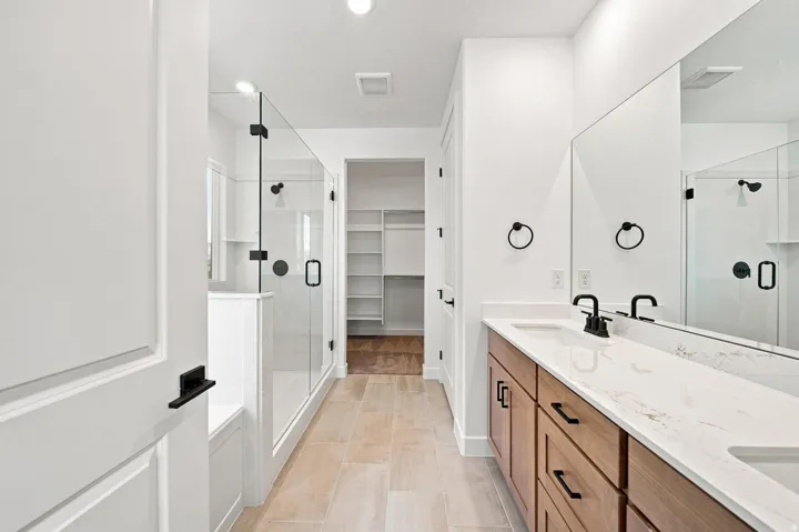Double vanity with integrated sinks and a stone countertop
