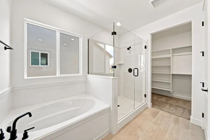 Soaking tub with matte black fixtures