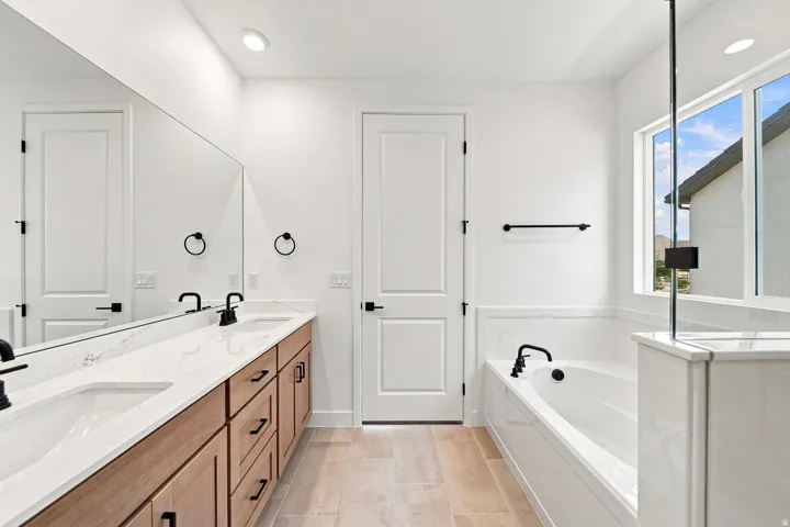 Dual vanity with undermount sinks and light-toned countertops