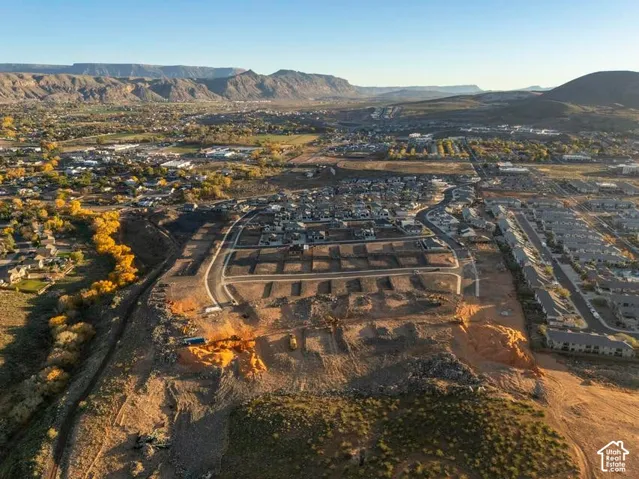 Developed community with mountain backdrop, established streets, and prepared parcels