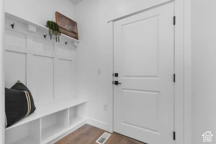 White paneled door with black hardware