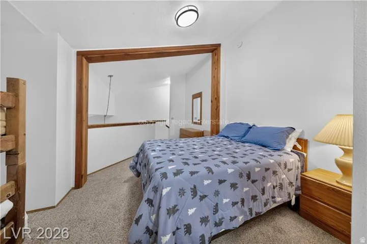 Carpeted flooring with white wall finishes
