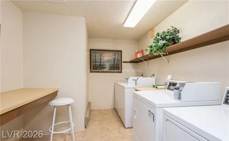 Wall-mounted shelving, built-in counter space, and integrated fluorescent lighting
