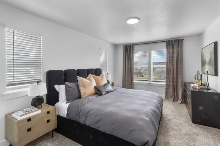 Carpeted flooring paired with neutral wall tones