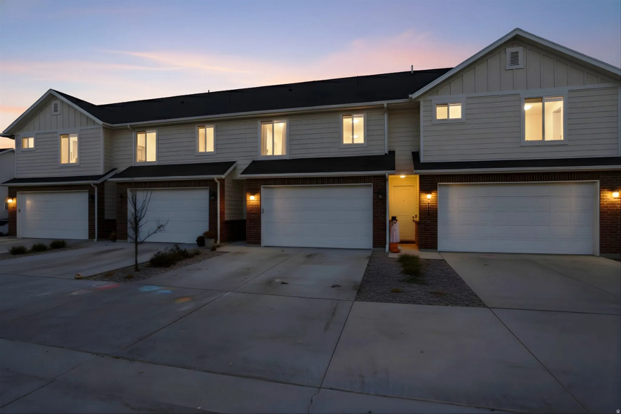 Exterior featuring siding and brick accents