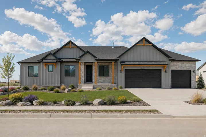 Modern exterior featuring vertical siding, stone accents, and a dual-bay garage