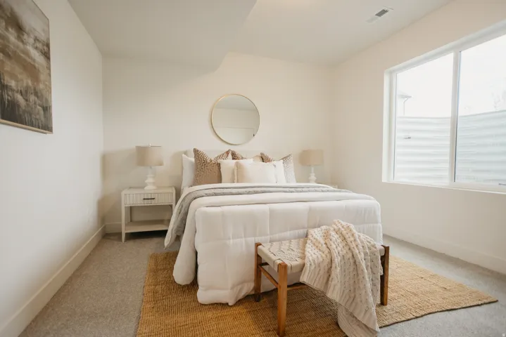Wall-to-wall carpeting and white painted walls
