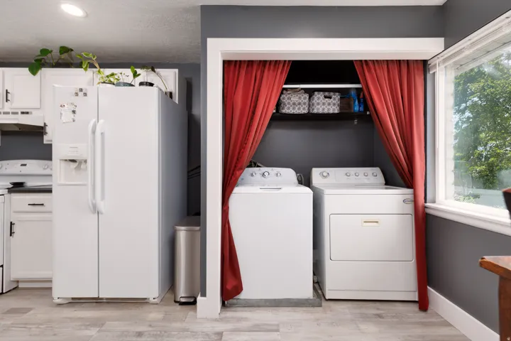 Dedicated laundry area with shelving