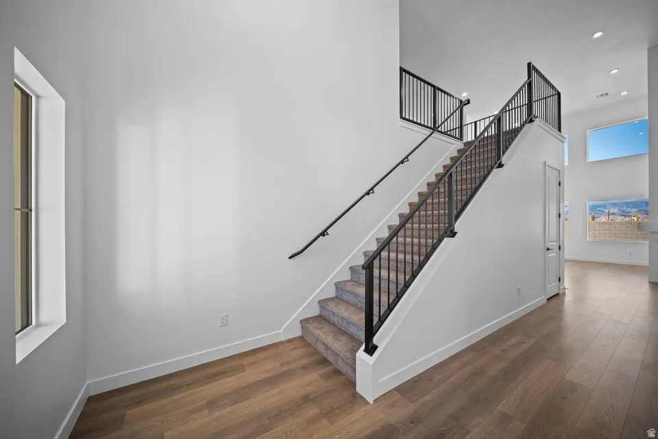 Open-concept living space with wood-finish flooring