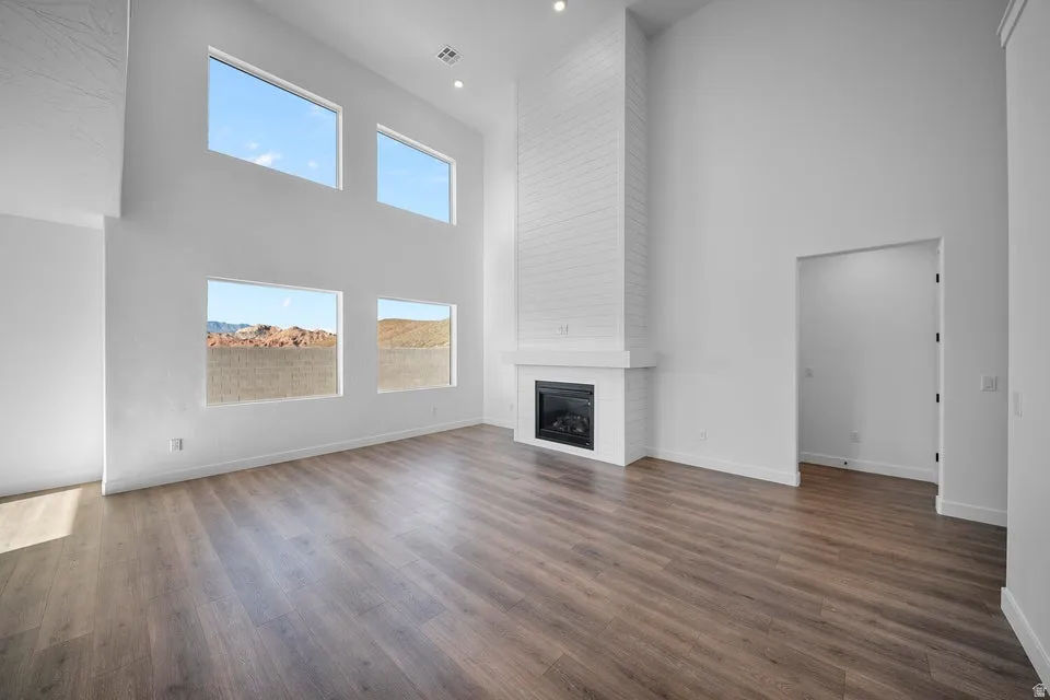 High ceilings complement the wood-finish flooring