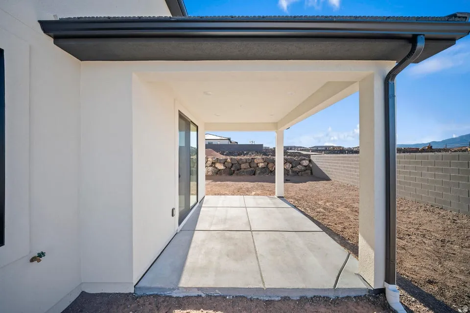 Covered patio featuring a concrete slab and direct outdoor access