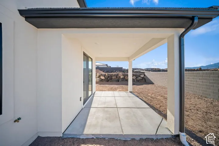 Covered patio featuring a concrete slab and direct outdoor access