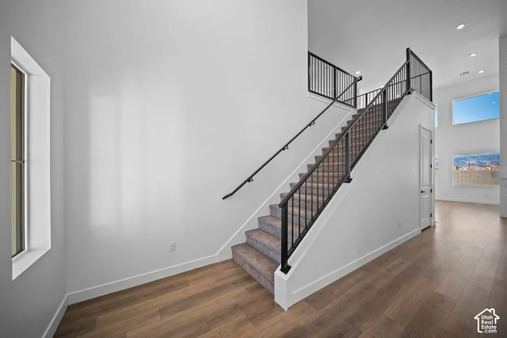 Open-concept living space with wood-finish flooring