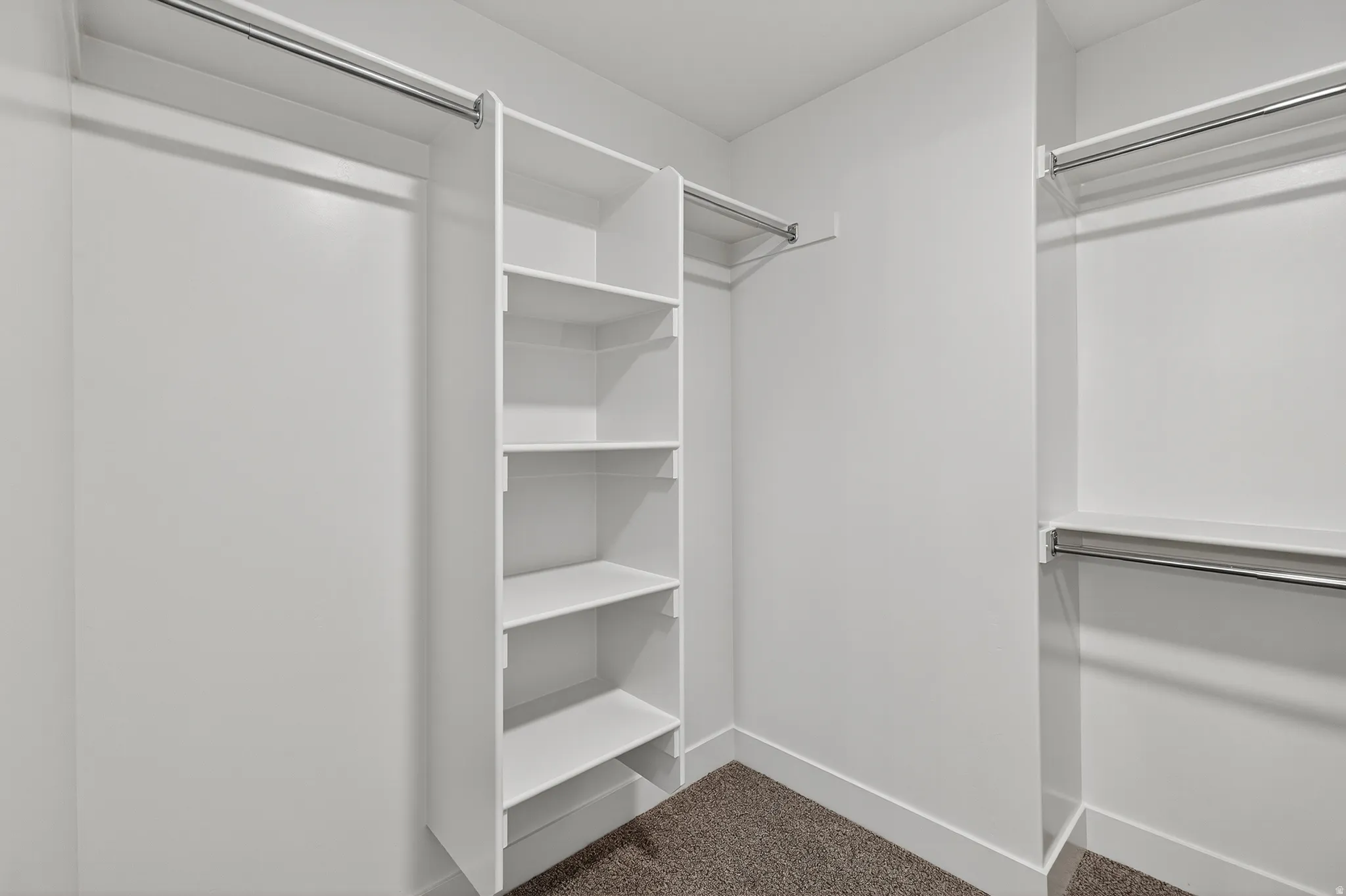 Integrated shelving unit with multiple storage shelves and hanging rods