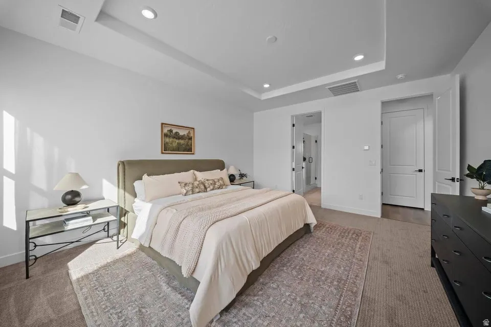 Recessed lighting illuminating the tray ceiling