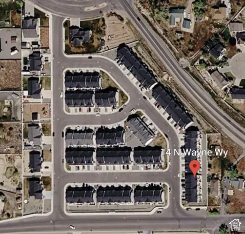 Aerial perspective of a developed residential community with townhome-style residences