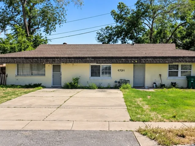 Property Image. Exterior view of the property from the street level, showing the front facade and immediate surroundings