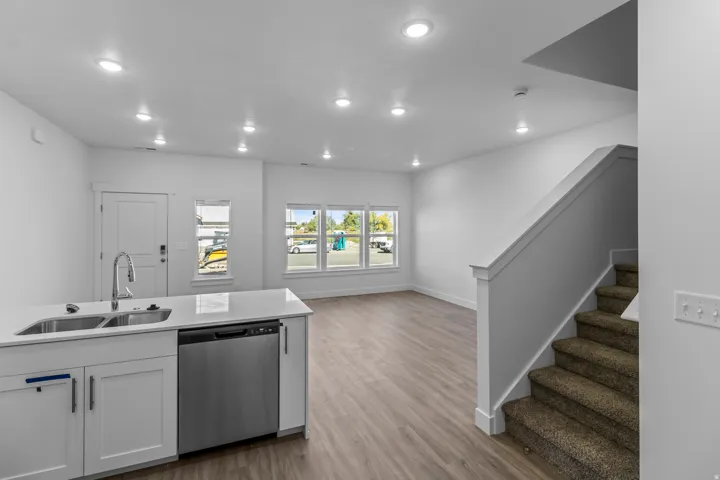 Kitchen island with double basin sink and stainless steel appliance