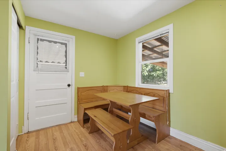 Wood-finish flooring with light green walls