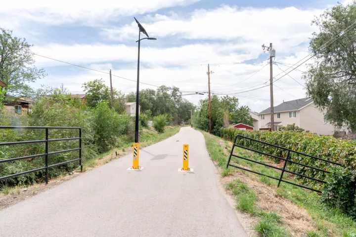 Ease of exercise! Behind the backyard fence, is a well-maintained walking and bike path.