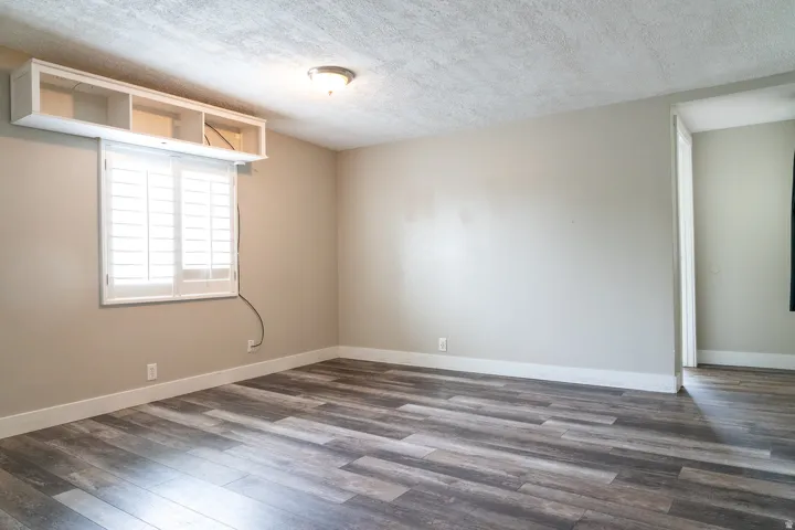 Large family room has shelving for projector equipment.