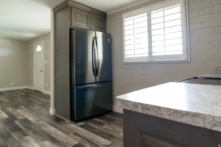 Wood-finish flooring, built-in cabinetry, wonderful French door refrigerator included.