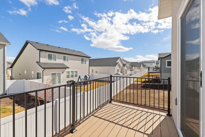Exterior deck with composite decking and black metal railings