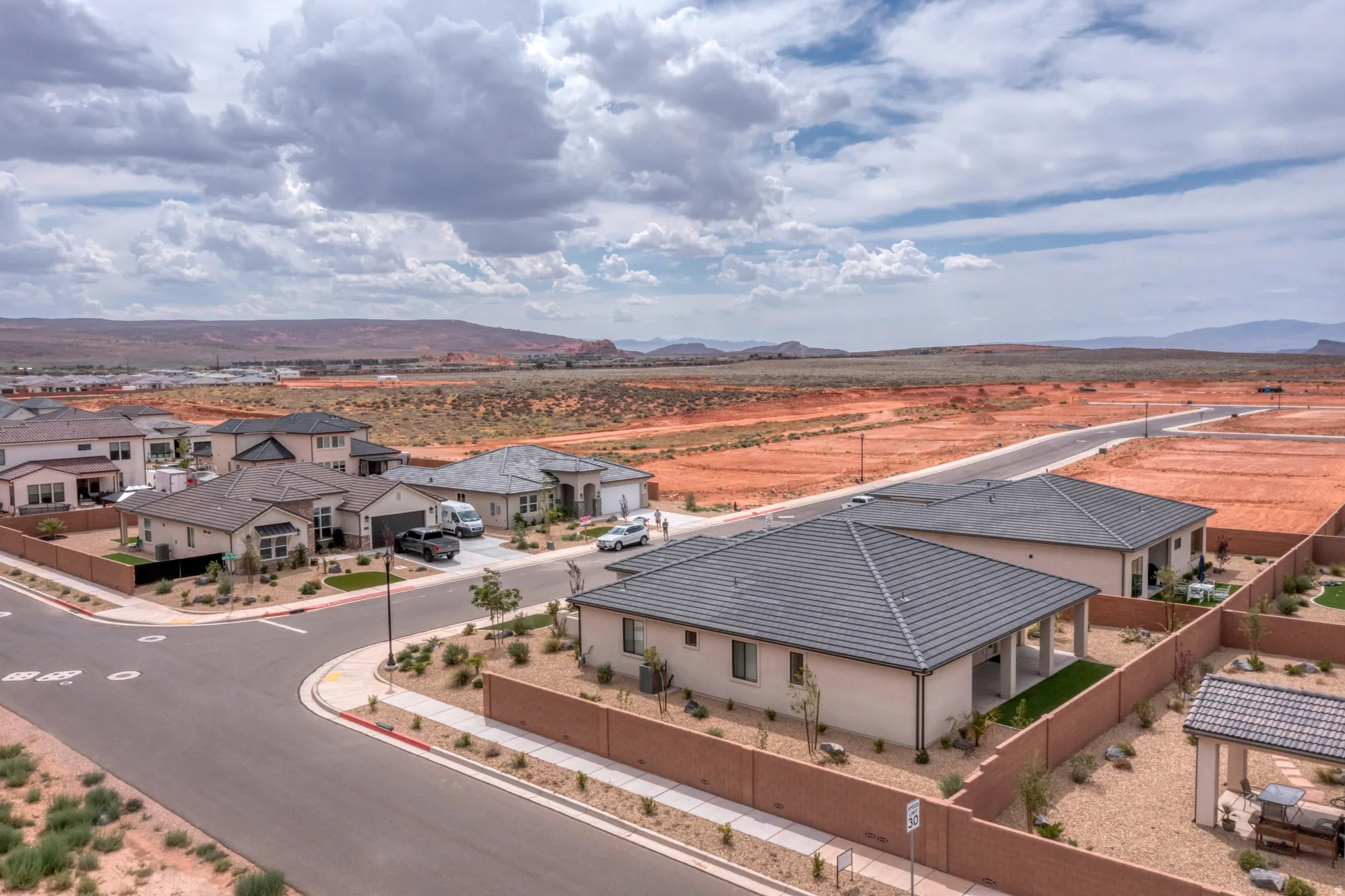 Contemporary residential neighborhood with newly constructed homes, established streets, and mature landscaping elements