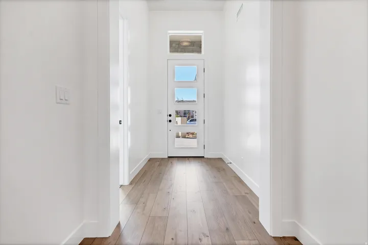 Entryway featuring a contemporary door with multiple lites and transom window