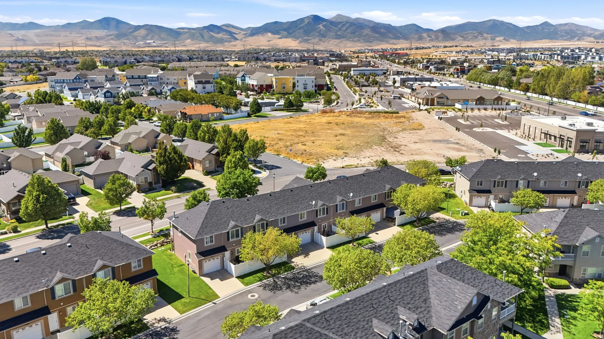 Aerial perspective showcasing residential development with mountain backdrop