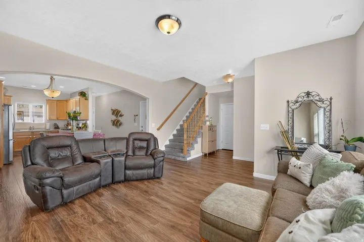 Wood-finish flooring throughout, with a carpeted staircase