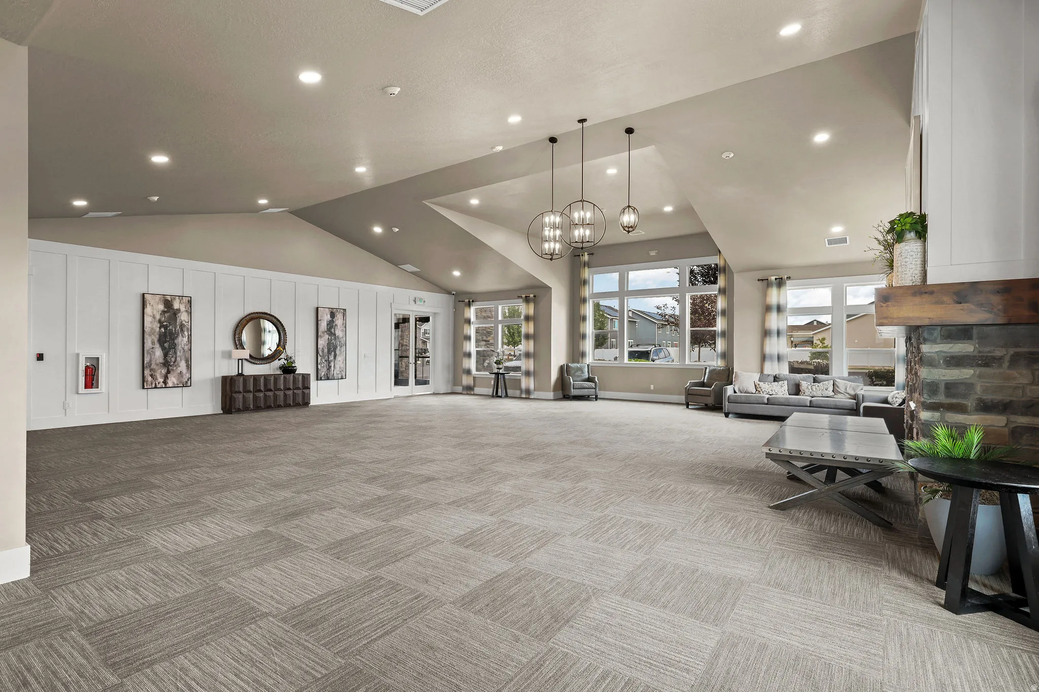 Spacious interior with vaulted ceilings, recessed lighting, and large windows