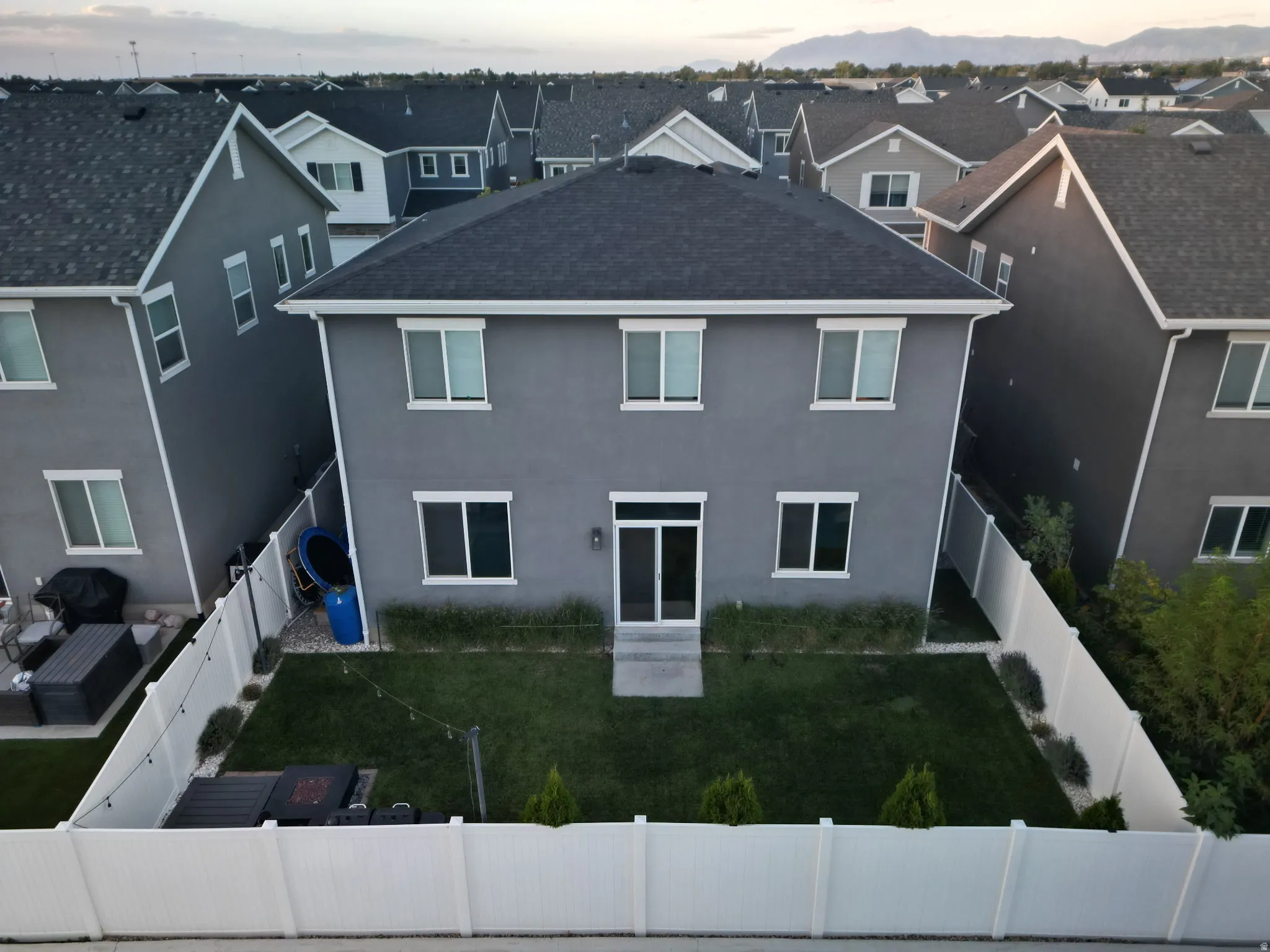 Two-story stucco exterior with multiple windows