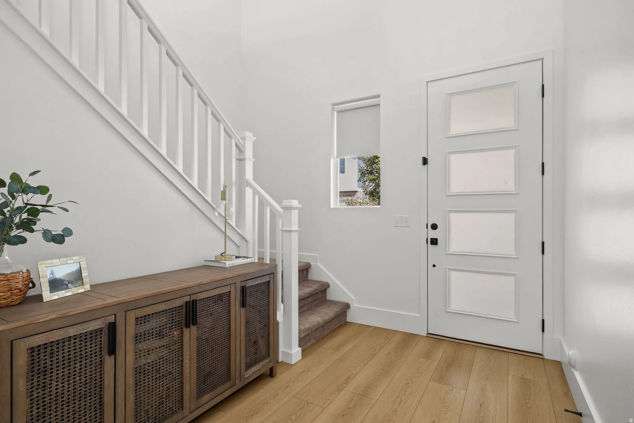 Wood-finish flooring throughout the entryway