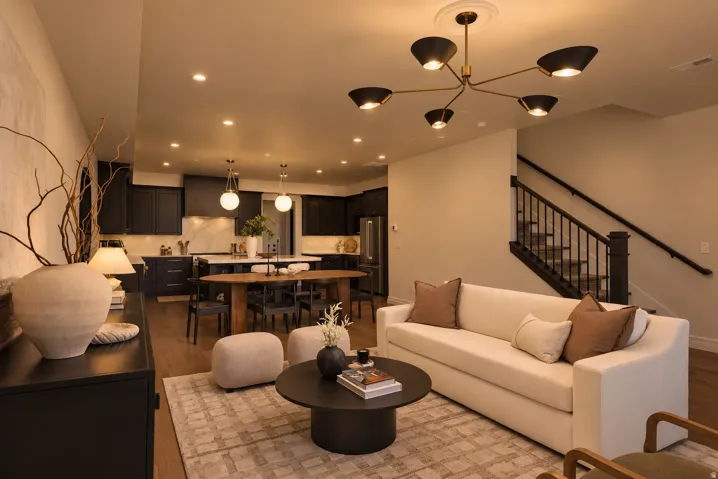 Open-concept living space featuring wood-finish flooring and recessed lighting