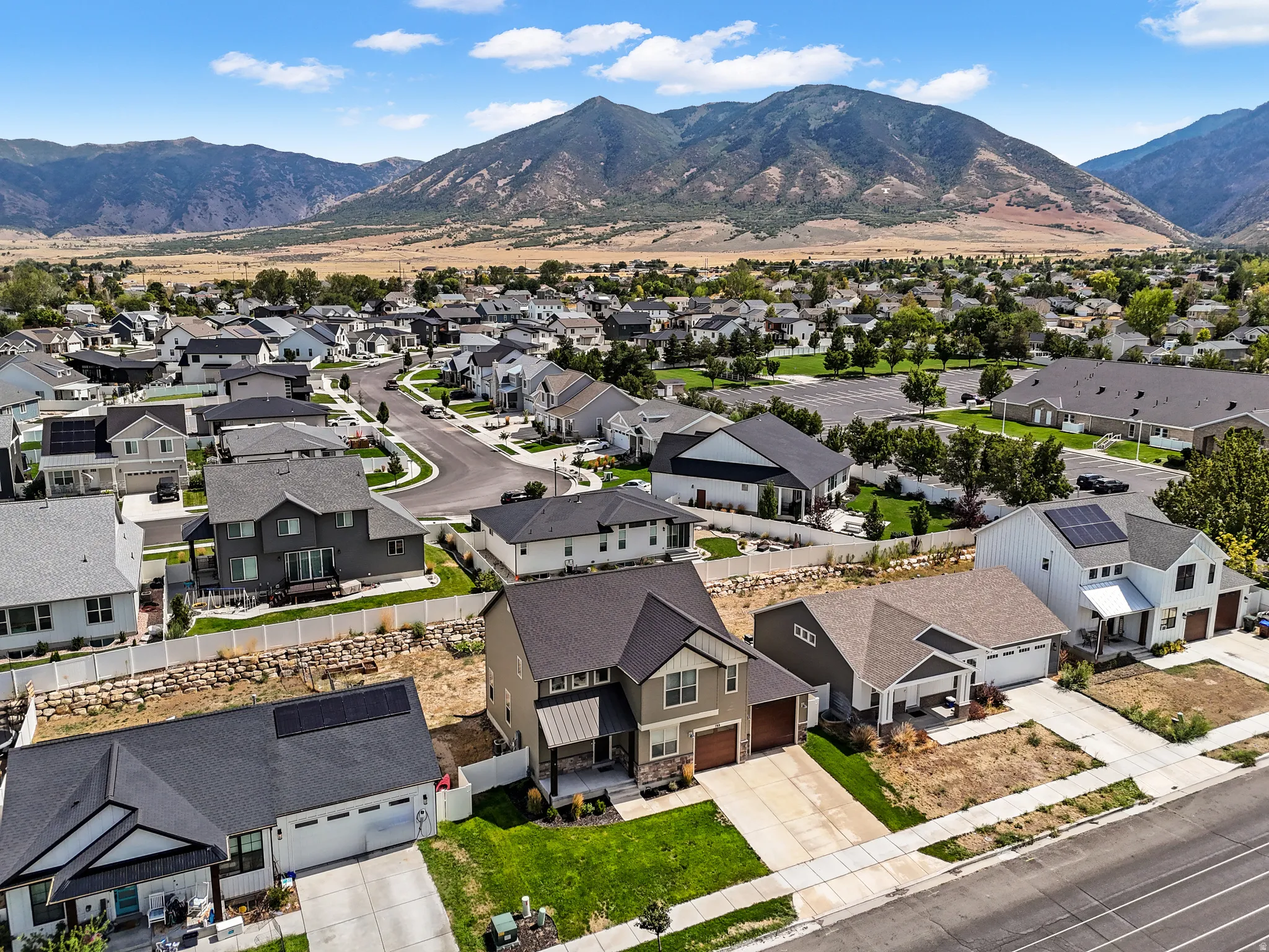 Mountain backdrop, residential neighborhood, cul-de-sac street, paved roads, and established housing