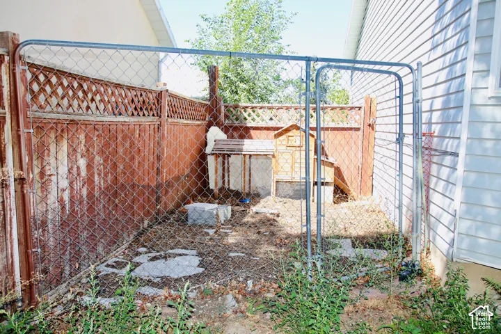 Chain-link enclosure could be chicken coop or dog run