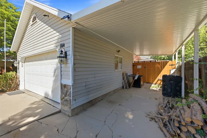Attached single-car garage with a stone veneer accent