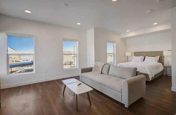 Recessed lighting, wood-finish flooring, and multiple windows