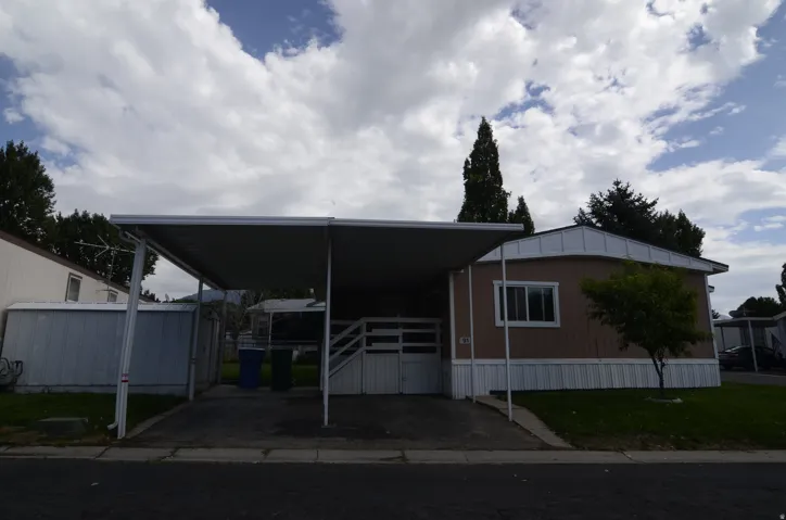 Attached carport with paved driveway