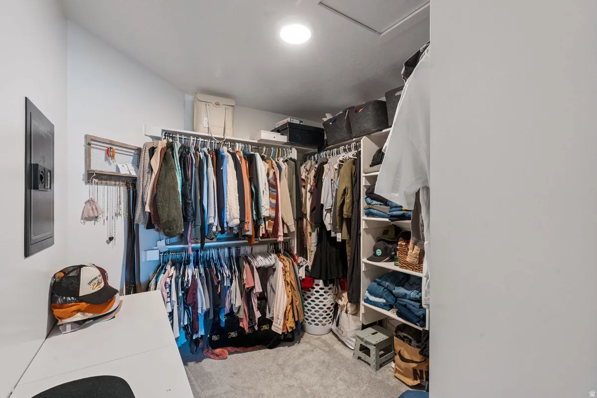 Built-in closet organization system featuring multiple hanging rods and integrated shelving
