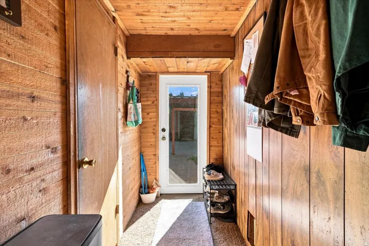 Wood-paneled walls and ceiling